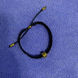 Pandora charm and braided bracelet.